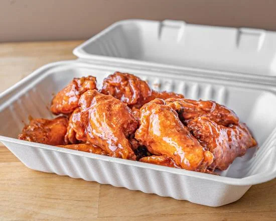 Thick-crust pizza with generous toppings at Acadia Pizza Calgary